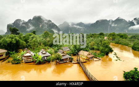 floating river in vangvieng lao after raining day at the morning time with the mist on the hill Stock Photo