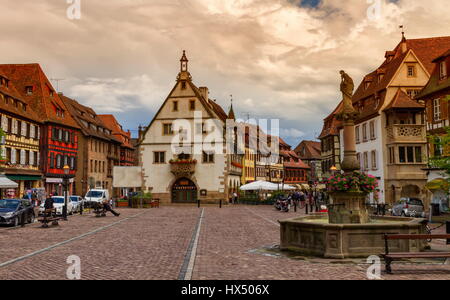 Marketplace in Obernai village with Saint-Odile fountain, the wheat hall, Alsace, France Stock Photo
