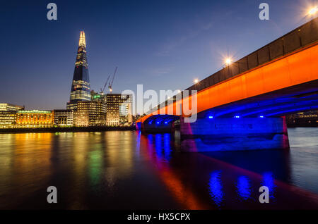 Shard skyscraper with London Bridge in blue hour Stock Photo