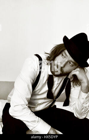 Retro Portrait of man with top had and bow tie thinking Stock Photo