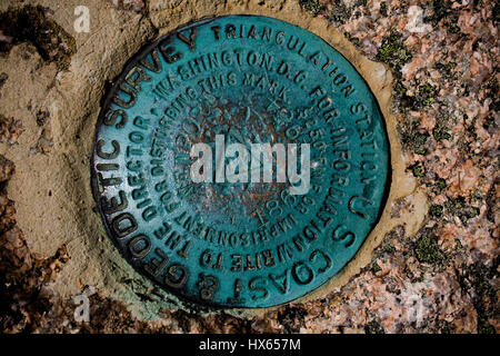 A geodetic survey marker at Acadia National Park near Bar Harbor, Maine. Stock Photo