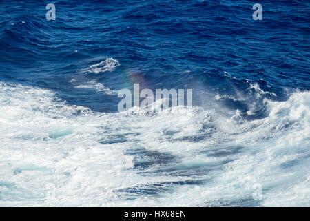 Huge waves and rough seas and sunshine on the open deep ocean