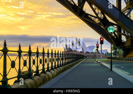 Sydney Opera House at dawn viewed from under the Sydney Harbor Bridge Stock Photo