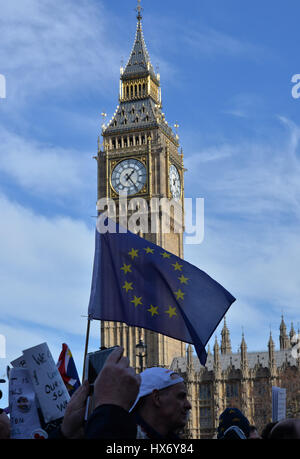 A European Union flag is flown in front of Big Ben as pro-EU protesters gather in Parliament Square, central London, during a March for Europe rally against Brexit. Stock Photo