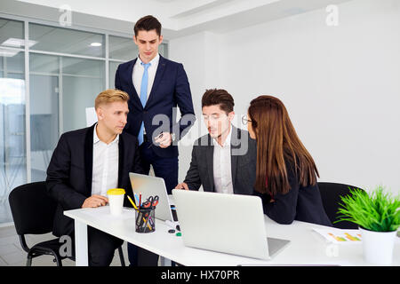 Businessteam working at  desk  a modern office. Training busines Stock Photo
