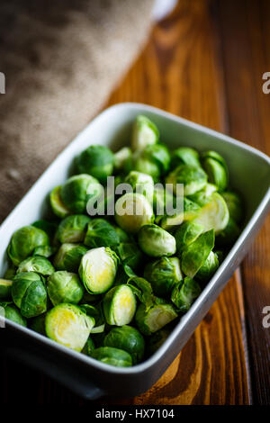 raw Brussels sprouts in ceramic form Stock Photo