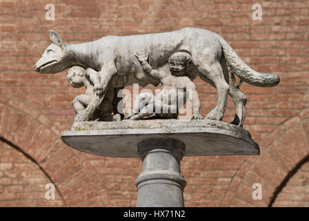 She-wolf with Romulus and Remus in front of the Duomo of Siena, Tuscany, Italy Stock Photo