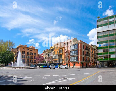 PALMA DE MALLORCA, SPAIN - MARCH 25, 2017: 19th century colorful buildings in sunshine on Plaza de la Reina on March 25, 2017 in Palma de Mallorca, Sp