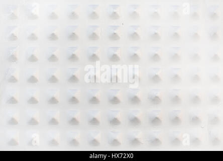 Gray metallic background texture with pyramid shaped knobs copy space. Stock Photo