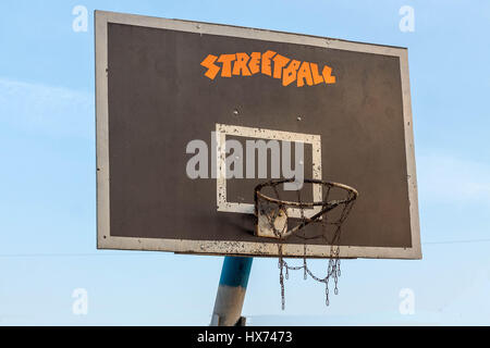 Basketball ring. Side view. Blue sky. Basketball hoop. Basket street basketball. Stock Photo