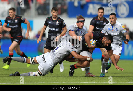Saracens' Billy Vunipola is tackled by Bath's Taulupe Faletau during the Aviva Premiership match at Allianz Park, London. Stock Photo