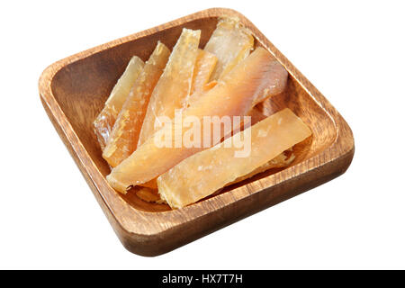 Wooden bowl with slices of dried salted, dry-cured fish flatfish isolated on white background.  Dry and salted  fish fillet seafood. Stock Photo