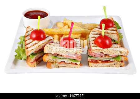 Club sandwich with chicken fillet, French fries, tomato sauce, on white rectangular plate isolated on white background. Stock Photo