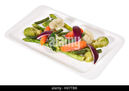 Vegetarian dishes, steamed vegetables on a white rectangular plate isolated on white background. Stock Photo