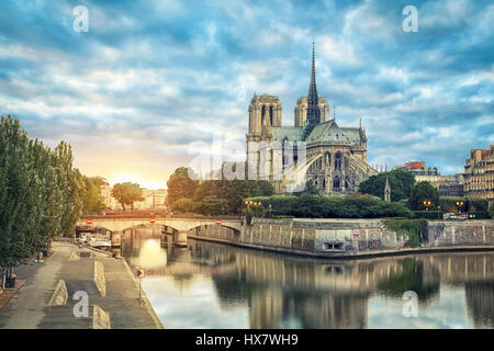 Notre Dame de Paris cathedral reflecting in river on sunrise, Paris, France Stock Photo