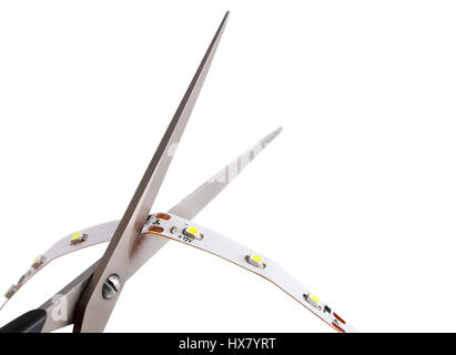 Closeup, LED Flexible Light tape may be cut at any of the points indicated by the scissor icons, isolated on  white background. Stock Photo