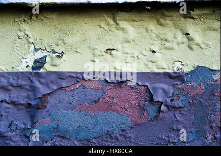 Rotten concrete wall with blown paint Stock Photo
