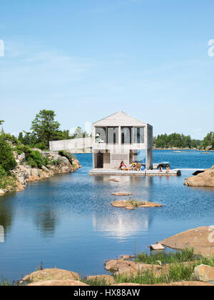 Overall contextual exterior view. Floating House, Private Island, Georgian Bay, Lake Huron, Canada. Architect: MOS Architects, 2007. Stock Photo