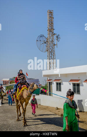 KUTCH, GUJARAT, INDIA - DEC. 27, 2016: Unidentified Indian tourists riding camels at Kalo Dungar or Black hill. The highest point in Kutch, Gujarat Stock Photo