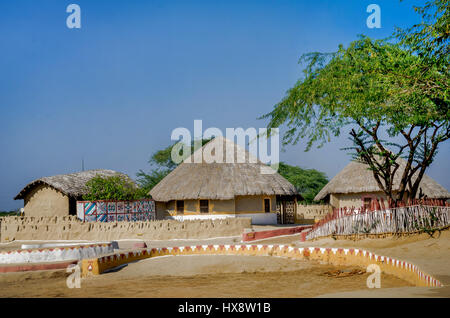 KUTCH, GUJARAT, INDIA - DECEMBER 27, 2016: A group of Bhungas at Hodka village, Kutch. Gujarat, India. 'Bhunga' is a traditional Kutchi Mud Hut. Stock Photo