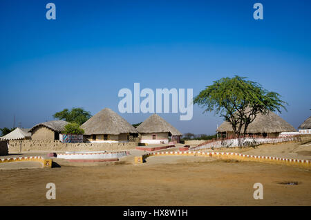 KUTCH, GUJARAT, INDIA - DECEMBER 27, 2016: A group of Bhungas at Hodka village, Kutch. Gujarat, India. 'Bhunga' is a traditional Kutchi Mud Hut. Stock Photo