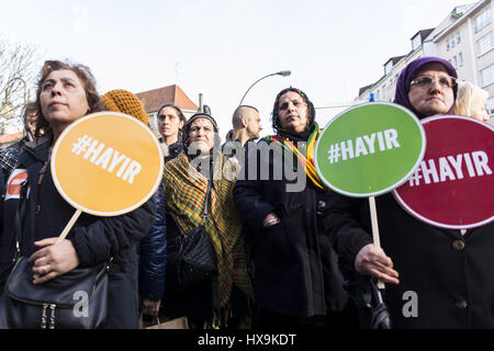 Berlin, Germany. 25th Mar, 2017. Opponents of RECEP TAYYIP ERDOGAN, President of Turkey, holding signs with the inscription '#Hayir'. Several hundred people rally in Berlin Neukoelln and Kreuzberg, the protesters damand a No vote in the constitutional referendum in Turkey, where Turks living in Germany are allowed to vote. Credit: Jan Scheunert/ZUMA Wire/Alamy Live News Stock Photo