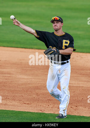 Pittsburgh Pirates' Adam Frazier, right, stands on third base next