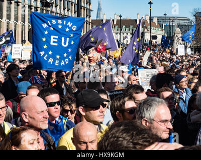 London, UK. 25th Mar, 2017.  Tens of thousands of Europeans march from Park lane to Parliament Square . Missing the EU already banner and paper mache head of PM Theresa May Credit: Ghene Snowdon/Alamy Live News