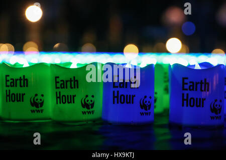 Berlin. 25th Mar, 2017. Photo taken on March 25, 2017 shows lights with words 'Earth Hour' placed on the ground for the annual Earth Hour event in Berlin, capital of Germany. Credit: Shan Yuqi/Xinhua/Alamy Live News Stock Photo