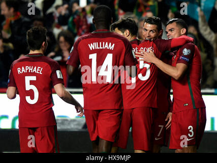 Lisbon, Portugal. 25th Mar, 2017. Cristiano Ronaldo(2nd R) of Portugal celebrates scoring with teammates during the FIFA World Cup 2018 Qualifiers Group B match between Portugal and Hungary at the Luz stadium in Lisbon, Portugal, on March 25, 2017. Portugal won 3-0. Credit: Zhang Liyun/Xinhua/Alamy Live News Stock Photo