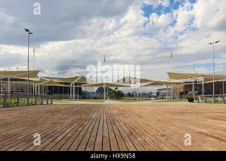 The large leisure area has wooden decks for walking and contemplating nature. Built to host most of the competitions during the Rio 2016 Olympic Games, the Olympic Park has been transformed into a leisure area and is under the management of the Brazilian Federal Ministry of Sports. However, the site remains mostly empty because few people use the space because of lack of structure. There are no public restrooms or drinking fountains for use by the public and not even places for food like foodtrucks or snack bars. Despite this, the place is very well taken care of, with private security guards  Stock Photo