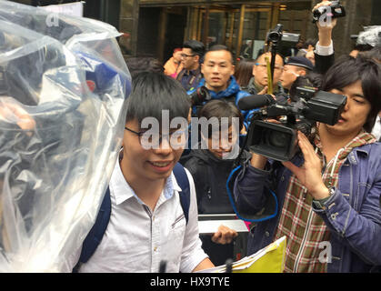 Student leader Joshua Wong (l) leads a protest to the convention center during the election of Carrie Lam as the new head of government in Hong Kong, China, 26 March 207. Prominent in Hong Kong, Carrie Lam, the new head of the Chinese Special Administrative Region, has been named the new head of government in Hong Kong. Photo: Christy Choi/dpa Stock Photo