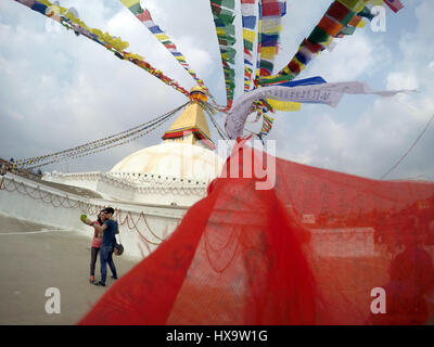 Kathmandu, Nepal. 9th May, 2015. Tourists take a photograph in front of the Boudhanath Stupa, a UNESCO World Heritage Site in Kathmandu, Nepal on Sunday, March 26, 2017. Listed for outstanding cultural values, the seven monuments in the Kathmandu valley will be placed in the World Heritage site danger list if criteria not met claimed an official at UNESCO. UNESCO is also not happy with the pace of reconstruction from the earthquakes 2 years back in the Kathmandu valley and the way it is being done. Credit: Skanda Gautam/ZUMA Wire/Alamy Live News Stock Photo