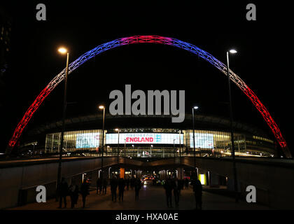 Wembley Stadium, London, UK. 26th March 2017. World Cup 2018 Qualification football, England versus Lithuania; Wembley Stadium arch lit up in red, white and blue colours to in memory of those who died in the Westminster terror attacks as the fans leave the stadium Credit: Action Plus Sports Images/Alamy Live News Stock Photo