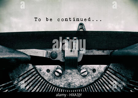 To be continued words typed on a vintage typewriter in black and white. Stock Photo