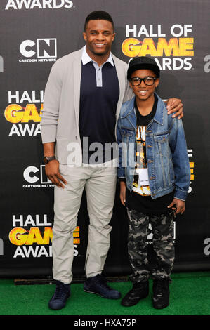 Wide receiver Randall Cobb of the Green Bay Packers (l) arrives at the 4th Annual Cartoon Network Hall Of Game Awards at Barker Hangar on February 15, 2014 in Santa Monica, California. Stock Photo