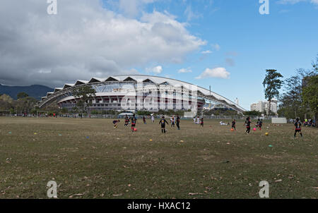 Football Playing children in front of the national stadium in San Jose, Costa Rica Stock Photo