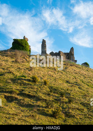 Wispy clouds and blue sky above the historic remainds of Corfe Castle, Corfe Castle, Dorset, UK