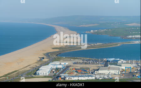 Portland Harbour, Dorset, UK. 26th March 2017. A view over Chesil Beach on a crisp windy sunny day at Portland Harbour on Mothering Sunday.  © Dan Tucker/Alamy Live News Stock Photo