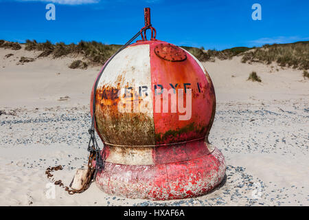 Buoy on beach at Aberdovey (Aberdyfi), Gwynedd, Wales Stock Photo