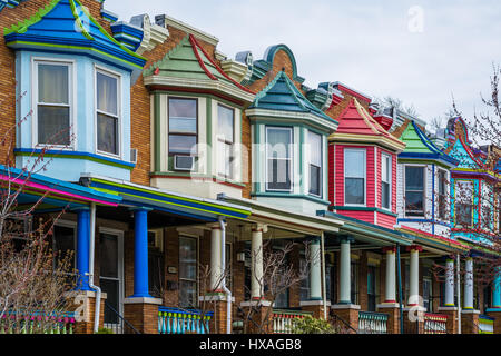 Colorful row houses along Guilford Avenue in Charles Village, Baltimore ...