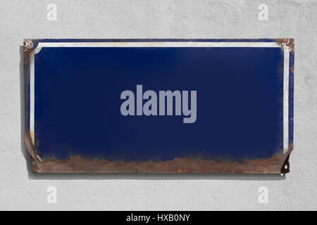 Old rusty vintage blue sign with grey background Stock Photo