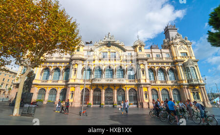 Barcelona, Spain, Nov 3rd, 2013:   Bicycle tours - active group of tourists meet with their bikes in front of old theatre building at Rambla del Mar. Stock Photo