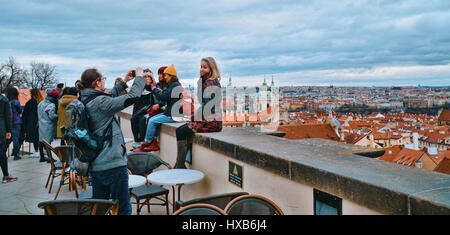 Enjoying the great overlook over Prague from the castle - PRAGUE / CZECH REPUBLIC - MARCH 20, 2017 Stock Photo