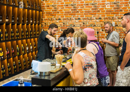 People tasting samples of rum products as part of a Distillery Tour at the Bundaberg Rum visitor centre.  Bundaberg, Queensland, Australia Stock Photo