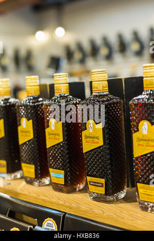 Bottles of rum products on the shelves of the Bundaberg Rum Distillery Visitor Centre, Bundaberg, Queensland, Australia Stock Photo