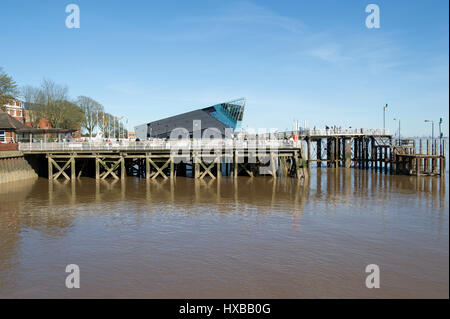 Tourists on the Jetty at the Marina near Humber Street in Kingston Upon Hull, UK City of Culture 2017,  with The Deep aquarium in the background. Stock Photo
