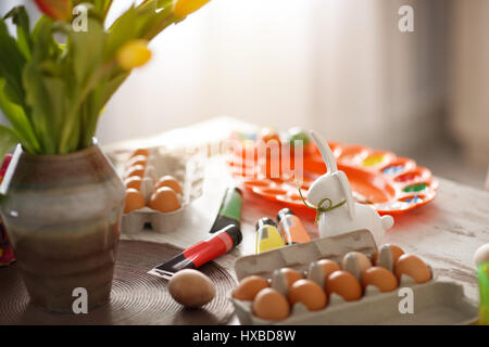 Eggs and paints for Easter eggs on the table, concept Stock Photo