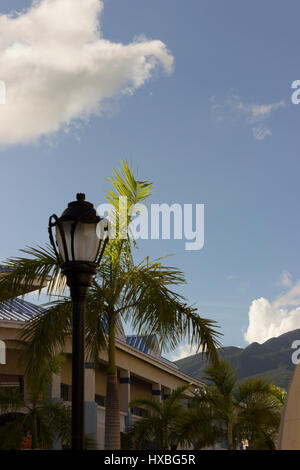 A lamp post set against the tropical blue sky of St Kitts. Stock Photo