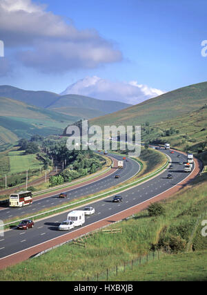 M6 uk motorway traffic red hard shoulder scenic countryside landscape Lune Gorge part of River Lune Valley edge Lake District National Park Cumbria UK Stock Photo